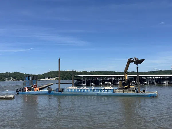 Work barge staged alongside a marina