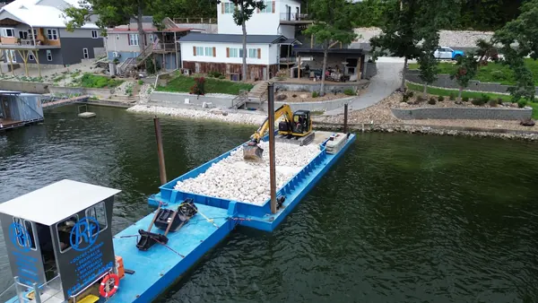 Barge loaded with rock for a shoreline job
