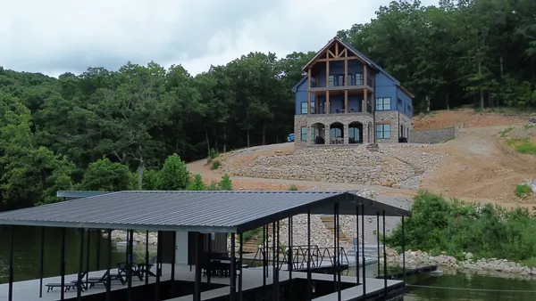 New dock below an A-frame lake home