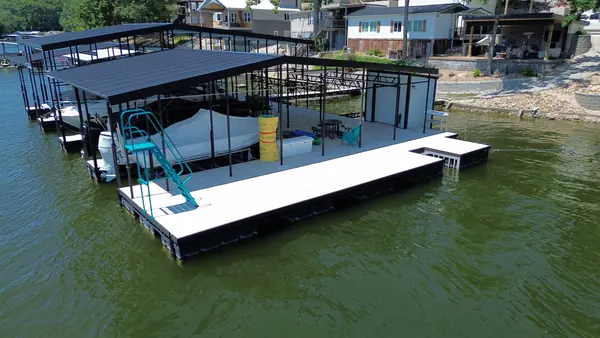 Dock with white decking, slide and swim platform