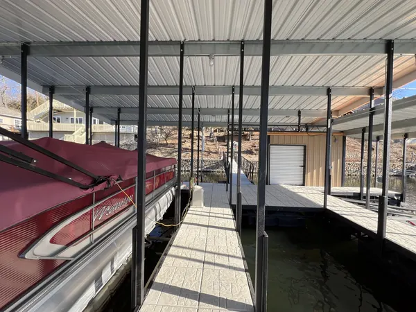 Under the dock roof with a pontoon in its slip