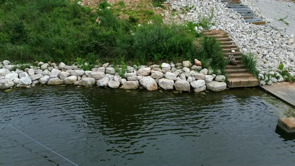 Rip rap with stone steps down to the water