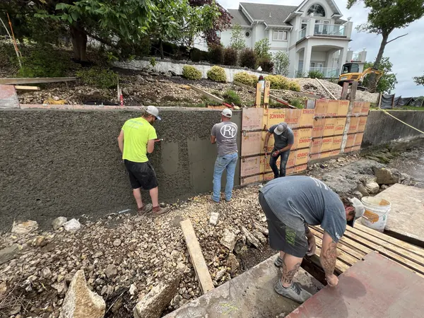 Crew forming a new concrete seawall
