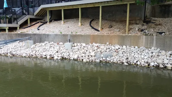 Seawall below a lakeside pergola