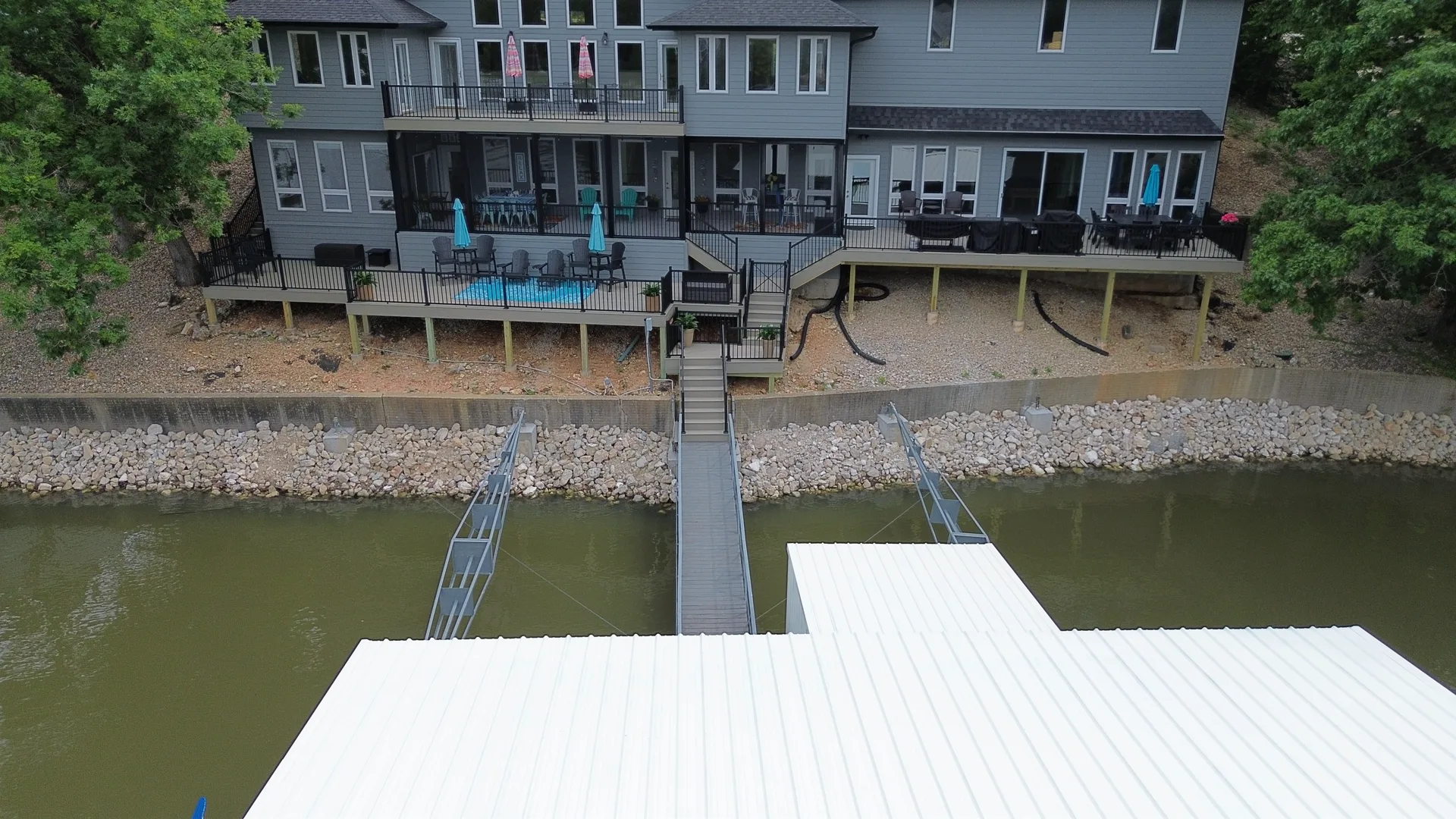 Dock and shoreline being serviced along a residential lakefront