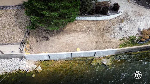 Repaired lakefront seawall along a residential shoreline