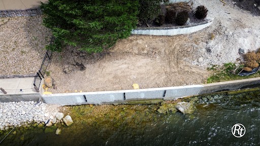 Repaired lakefront seawall along a residential shoreline